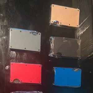 Wallet/card holder with money clip on back.